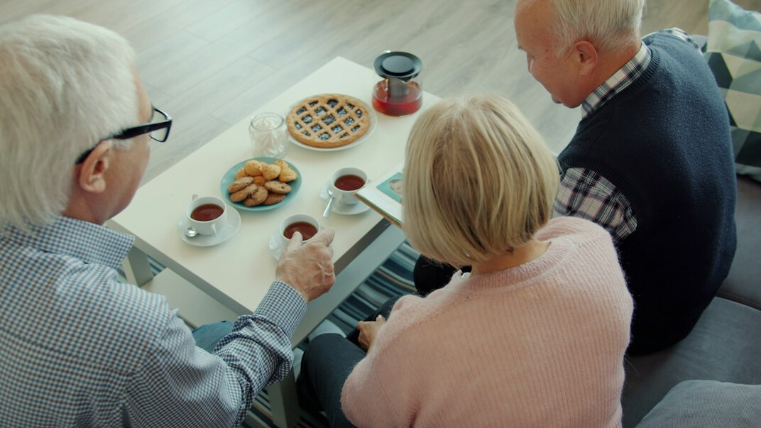 seniors sharing meal together