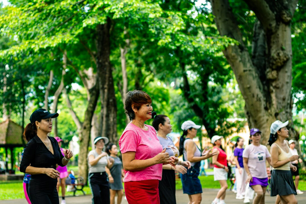 group of seniors walking in park