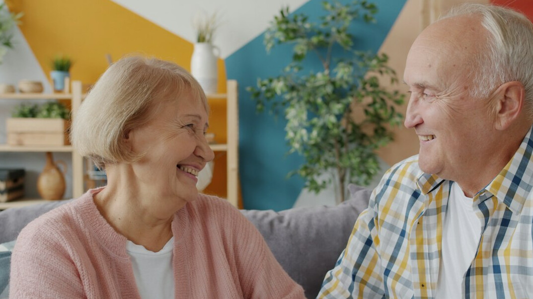 elderly couple smiling